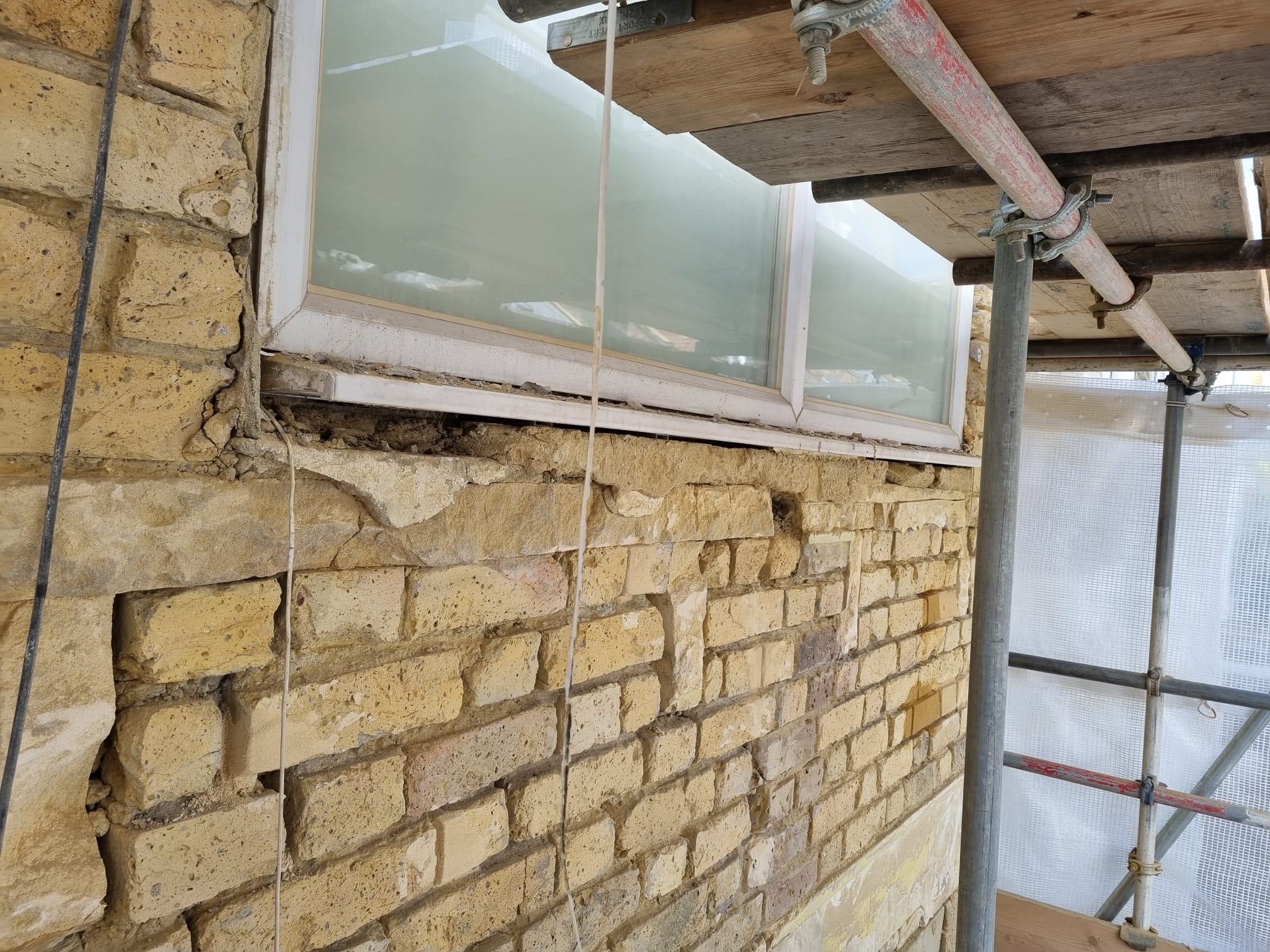 Failed pointing requiring listed building restoration London specialist