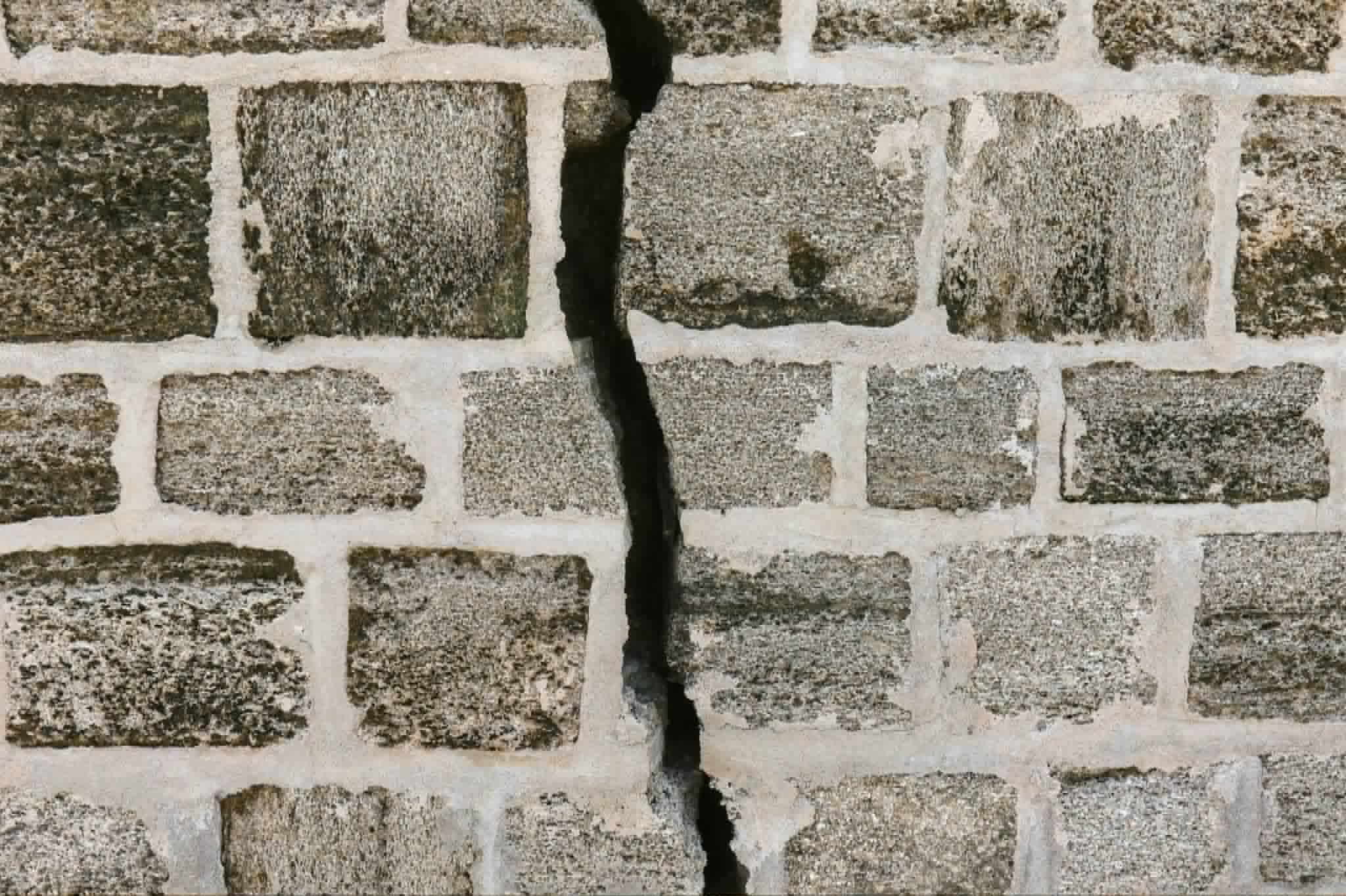 Cracked stonework requiring specialist masonry repair in London