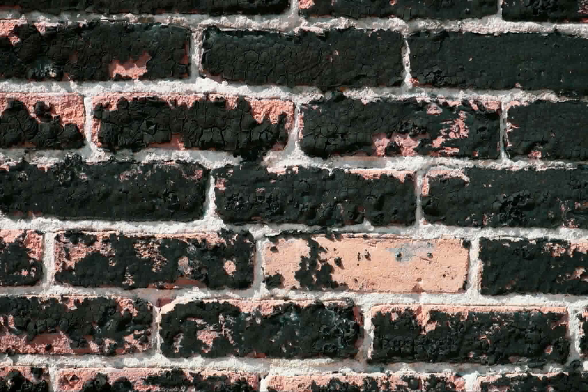Exposed brickwork after render removal London